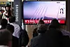 Citizens watch a news report on North Korea firing around 10 short-range ballistic missiles into the East Sea at Seoul Station in central Seoul on Thursday morning. [NEWS1]