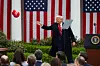 U.S. President Donald Trump tries to reach a MAGA hat, on the day of his remarks on tariffs in the Rose Garden at the White House in Washington April 2, 2025. [REUTERS/YONHAP]