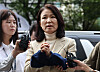 Lee Jin-sook, former chief of the Korea Communications Commission, speaks to reporters as she enters the Seoul Southern District Court in Seoul on Oct. 4. [YONHAP]
