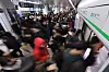Passengers scramble on a subway platform at Sindorim Station in Guro District, southern Seoul on Wednesday morning, when some employees of the train service operator Seoul Metro began a work-to-rule protest. [YONHAP]