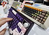 A hand is seen typing on a mechanical keyboard on display at the Seoul Mechanical Keyboard Expo 2025 on March 23. [YONHAP]