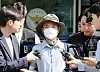 Che Zhenan, a Chinese national of Korean ethnicity accused of killing two people and injuring two others, appears outside Siheung Police Station in Siheung, Gyeonggi, on May 21, 2025. [YONHAP]