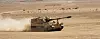A K9 self-propelled howitzer made by Hanwha Aerospace is seen tearing through a desert in the Middle East on Feb. 2. [HANWHA AEROSPACE]