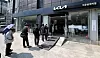 Voters wait in line to cast their ballots at a polling station set up inside the Kia Motors Daegongwon dealership in Gwangjin District, eastern Seoul, on June 3, the day of the 21st presidential election. [NEWS1]