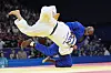 Korea's Kim Min-jong and France's Teddy Riner compete during their men's 100-kilogram final at Champ-de-Mars Arena in Paris on Friday. [AP/YONHAP]