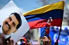 A supporter of Venezuelan President and presidential candidate Nicolas Maduro raises a dummy of the character known as ″Super Bigote,″ which represents Maduro, during his campaign closing rally in Maracaibo, Zulia State, Venezuela on July 25, 2024. [AFP/YONHAP]