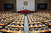Lawmakers attend a plenary session of the National Assembly on an amendment to the Criminal Act, at the National Assembly in Yeouido, western Seoul, on Feb. 26. [YONHAP]