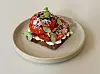 Smorrebrod, Danish open-faced sandwich, with whipped ricotta and tomato jam, topped with fresh tomato slices, cheese shavings and dry black olive bits at Danish eatery Mitbord [LEE JIAN]