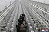 North Korean leader Kim Jong-un, second from top, inspects a nuclear-material production base with officials, in this file photo published by the Korean Central News Agency on Jan. 29. [KOREAN CENTRAL NEWS AGENCY]