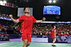 Si Wei Zheng of China and Ya Qiong Huang of China celebrate after beating Kim Won-ho and Jeong Na-eun of Korea in the mixed badminton gold medal match in Paris on Friday. [REUTERS/YONHAP]