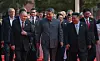 From left: Russian President Vladimir Putin, Chinese President Xi Jinping, North Korean leader Kim Jong-un and heads of other foreign delegations emerge onto a rostrum in Tiananmen Square in Beijing on Sept. 3. [TASS/YONHAP]