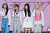Fifty Fifty members pose for a photo at a press conference held in April 2023. [NEWS1]