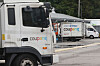 The photo shows vehicles coming and going at a Coupang logistics center in Seoul on Aug. 6. [YONHAP]