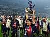 Lee Kang-in lifts the French Cup trophy after Paris Saint-Germain beat Lyon 2-1 in the final at Stade Pierre-Mauroy in France on Saturday. [REUTERS/YONHAP]