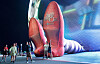 A couple pose for a photo in front of a display of 50-feet-long legs and 22-feet-tall ruby slippers, a promotion for the ″Wizard of Oz at Sphere″ movie, in Las Vegas, Nevada on Aug. 20. [REUTERS/YONHAP]