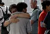 A Korean worker who had been detained by U.S. immigration authorities in Georgia reunites with family at Incheon International Airport on Sept. 12. [JOINT PRESS CORPS]