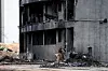 Police patrol near a damaged building at the crash site, where an Air India Boeing 787-8 Dreamliner plane, crashed during takeoff from an airport, in Ahmedabad, India, on July 12. [REUTERS/YONHAP]