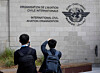 Members of the International Civil Aviation Organization (ICAO) agency take photos of the logo as they arrive at ICAO headquarters in Montreal on Oct. 1, 2022. [REUTERS/YONHAP]