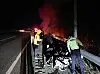 Police look through the wreckage of a car that crashed and burned at the Seohaean Expressway in Gyeonggi on March 27. [GYEONGGI FIRE SERVICES]