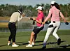 Korea's Amy Yang, left, is doused with champagne by friends on the 18th green after winning the CME Group Tour Championship in Naples, Florida on Sunday. [AFP/YONHAP]