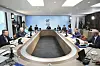 Britain's then Prime Minister Boris Johnson, center, with from left, Italy's then Prime Minister Mario Draghi, Australia's then Prime Minister Scott Morrison, then German Chancellor Angela Merkel, South Africa's President Cyril Ramaphosa, South Korea's then President Moon Jae-in, US President Joe Biden, French President Emmanuel Macron, Canada's then Prime Minister Justin Trudeau, Japan's then Prime Minister Yoshihide Suga and then President of the European Council Charles Michel during the G7 summit in Cornwall, England, Saturday June 12, 2021. (Leon Neal/Pool via AP)