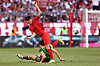 Wolfsburg's Jonas Wind, left, in action against Bayern Munich's Kim Min-jae during the match between Bayern Munich and VfL Wolfsburg in Munich, Germany on Sunday. [EPA/YONHAP]
