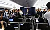 President Lee Jae-myung, center, holds a press conference aboard Air Force One en route to Calgary, Canada, to attend the G7 Summit on June 16. [JOINT PRESS CORPS]