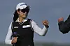 Kim A-lim of Korea bumps fists with her caddie after saving par on the 16th hole during the third round of the AIG Women's Open at Royal Porthcawl Golf Club in Porthcawl, Wales, on Aug. 2. [AP/YONHAP]