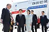 President Lee Jae-myung, center left, and first lady Kim Hye-kyung, center right, are greeted by Canadian officials upon arriving at Calgary International Airport in Alberta, Canada, on June 16. [JOINT PRESS CORPS]