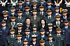 President Lee Jae Myung, center left, and first lady Kim Hea Kyung, center right, pose for a commemorative photo with newly commissioned officers during a joint commissioning ceremony of the Army, Navy and Air Force academies at Gyeryongdae, Korea's main military compound, in Gyeryong, South Chungcheong, on Feb. 20. [JOINT PRESS CORPS]