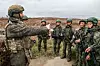 This photo from Russia's Tass News Agency shows a firearms training session with Russian instructors for servicemen from North Korea who were involved in Russia's operation to liberate the Kursk Region [YONHAP]