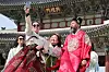 Tourists dressed in hanbok, or as traditional Korean dress, take selfies at Gyeongbok Palace in central Seoul on March 3, as visitors enjoyed the last day of a three-day weekend to mark the March 1 Independence Movement holiday. [NEWS1]