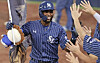 Lewin Diaz of the Samsung Lions is congratulated by teammates after hitting a solo home run against the KT Wiz during the clubs' KBO regular-season game at Daegu Samsung Lions Park in Daegu on Sept. 14. [SAMSUNG LIONS]