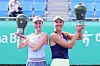 Liudmila Samsonova of Russia, left, and Nicole Melichar-Martinez of the United States pose with trophies after winning the 2024 Hana Bank Korea Open doubles final at Seoul Olympic Park Tennis Center in southern Seoul on Sunday. [NEWS1]