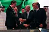 Elon Musk shakes hands with U.S. Secretary of Commerce Howard Lutnick next to Blackstone Group CEO Stephen A. Schwarzman during a visit to At-Turaif World Heritage Site, in Diriyah, Saudi Arabia, May 13. [REUTERS/YONHAP]