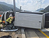 A Hyundai Staria van that hit a traffic light pole and overturned [GANGWON FIRE HEADQUARTERS]