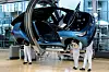Volkswagen employees work on the assembly of an ID.3 automobile on the electric cars production line at the Volkswagen Transparent Factory in Dresden, Germany, on May 14. [EPA/YONHAP]