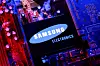A Samsung Electronics logo and a computer motherboard appear in this illustration taken on Aug. 25. [REUTERS/YONHAP]