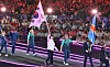 Korea's Choi Yong-beom, center, enters the 2024 Paris Paralympics Games closing ceremony at the Stade de France in Saint-Denis, France on Sunday with a Korean flag. [JOINT PRESS CORPS]