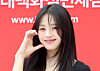 Minji of NewJeans makes a cheek heart at an event at the Hyundai Department Store Duty Free in Jung District, central Seoul, on Aug. 1. [NEWS1]