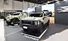 Kia's two-seat version of its Light Tactical Cargo Vehicle, left, and Tasman are displayed at the company’s booth during the 2025 International Defence Exhibition & Conference in Abu Dhabi, United Arab Emirates in February. [KIA]