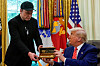 Elon Musk receives the key to the White House from U.S. President Donald Trump during a press conference in the Oval Office at the White House, in Washington on May 30. [REUTERS/YONHAP]