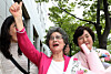 Choi Mal-ja gives a thumbs-up as she leaves the courtroom after being acquitted in a retrial at the Busan District Court in Busan on Sept. 10. [NEWS1]