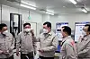Lotte Chairman Shin Dong-bin, center, examines the production facilities at Lotte Fine Chemical’s plant in Ulsan. [LOTTE FINE CHEMICAL]