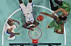 Bruno Caboclo of Brazil grabs a rebound over Frank Ntilikina and Nicolas Batum of France in a men's basketball game at the 2024 Paris Olympics in Villeneuve-d'Ascq, France on Saturday. [AP/YONHAP]