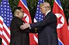 In this June 12, 2018, file photo, U.S. President Donald Trump, right, shakes hands with North Korea leader Kim Jong-un at the Capella resort on Sentosa Island in Singapore. [AP/YONHAP]