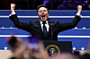 Tesla CEO Elon Musk gestures on stage as he prepares to speak inside the Capital One Arena on the inauguration day of Donald Trump's second presidential term, in Washington on Jan. 20. [YONHAP/ REUTERS]
