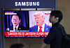 A television at Seoul Station in Yongsan District, central Seoul, on July 31 shows a report that U.S. President Donald Trump's administration has agreed to impose 15 percent tariffs on Korean products, 10 percentage points lower than what was proposed, under a trade deal that does not include tariffs the other way. [YONHAP]