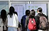 Students taking the College Scholastic Aptitude Test (CSAT) check their exam venues at a high school in Jeju on Nov. 13, 2024, the day before the exam. [YONHAP]