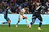 PSG's Lee Kang-in, center, in action against Yassine Kechta, left, of Le Havre during their match in Le Havre, France on Friday. [EPA/YONHAP]